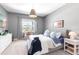 Cozy bedroom with neutral tones, a comfortable bed, and a bright window view at 7928 Redonda Loop, Bradenton, FL 34202