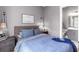 Comfortable bedroom with a decorative lamp and convenient access to the ensuite bathroom at 7928 Redonda Loop, Bradenton, FL 34202