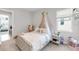 Charming bedroom featuring a canopy bed, soft colors, and decor, creating a cozy and inviting space at 7928 Redonda Loop, Bradenton, FL 34202