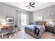 Bedroom featuring a desk, ceiling fan, and ample natural light for a welcoming atmosphere at 7928 Redonda Loop, Bradenton, FL 34202