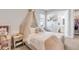 Charming bedroom featuring a canopy bed, soft colors, and decor, creating a cozy and inviting space at 7928 Redonda Loop, Bradenton, FL 34202