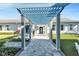 Covered walkway and lounge area leading to the community clubhouse in The Isles at Lakewood Ranch at 7928 Redonda Loop, Bradenton, FL 34202