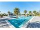 A refreshing community pool featuring lounge chairs and palm trees for a resort-style experience at 7928 Redonda Loop, Bradenton, FL 34202