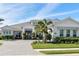 Beautiful one-story home with manicured landscaping, a gray roof and paver driveway at 7928 Redonda Loop, Bradenton, FL 34202