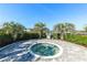 Community hot tub surrounded by mature landscaping and palm trees at 7928 Redonda Loop, Bradenton, FL 34202