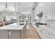 Spacious kitchen with a large island, stainless steel appliances, and seamless access to the outdoor area at 7928 Redonda Loop, Bradenton, FL 34202