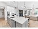 Open-concept kitchen with a large island, modern appliances, and a view to the living area at 7928 Redonda Loop, Bradenton, FL 34202