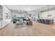 Bright open-concept living room flowing into a kitchen with a large island, perfect for entertaining at 7928 Redonda Loop, Bradenton, FL 34202