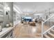 Open-concept living space with built-in shelving, hardwood floors, and a large window providing stunning views at 7928 Redonda Loop, Bradenton, FL 34202