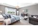 Spacious main bedroom with a large bed, dresser, and ample natural light at 7928 Redonda Loop, Bradenton, FL 34202