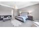 Elegant main bedroom featuring soft lighting, a comfortable seating area, and ample space at 7928 Redonda Loop, Bradenton, FL 34202