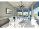 Clubhouse pool with outdoor seating and a covered lounge area featuring a TV at 7928 Redonda Loop, Bradenton, FL 34202