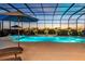 The luxurious indoor pool and hot tub are perfect for relaxing and enjoying the outdoors at 7928 Redonda Loop, Bradenton, FL 34202