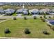 Street view of the neighborhood showcasing the beautiful landscaping and property exteriors at 7928 Redonda Loop, Bradenton, FL 34202