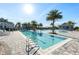 Resort-style community pool featuring lap lanes and a wading area surrounded by palm trees at 7928 Redonda Loop, Bradenton, FL 34202