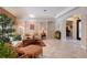 Spacious living room with neutral tones, decorative columns, and archway to an adjacent room at 8215 Waterview Blvd, Lakewood Ranch, FL 34202