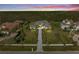 Sprawling single-story home with well-manicured lawn, mature trees, and a long driveway at 8455 Lindrick Ln, Bradenton, FL 34202