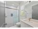 Bathroom featuring glass enclosed shower, modern fixtures, and bright lighting at 8455 Lindrick Ln, Bradenton, FL 34202