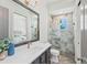 Bathroom featuring elegant vanity, shower with glass doors, and tile flooring at 8455 Lindrick Ln, Bradenton, FL 34202