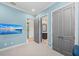 Bright bedroom featuring ensuite bathroom and access to outdoor pool area at 8455 Lindrick Ln, Bradenton, FL 34202