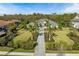 Stunning single-story home with lush landscaping, stone driveway, and a grand entrance at 8455 Lindrick Ln, Bradenton, FL 34202