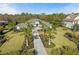Stunning home showcasing lush landscaping, a paver driveway and well-manicured lawn at 8455 Lindrick Ln, Bradenton, FL 34202