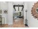 Elegant foyer showcasing open floor plan to living area and pool views from doorway at 8455 Lindrick Ln, Bradenton, FL 34202