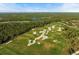 Aerial shot of a beautifully designed golf course, featuring multiple sand traps, water hazards and rolling greens at 8455 Lindrick Ln, Bradenton, FL 34202