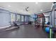 Home gym with modern equipment and mirrored wall at 8455 Lindrick Ln, Bradenton, FL 34202