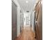 Hallway with wood floors and white trim leading to various rooms in the home at 8455 Lindrick Ln, Bradenton, FL 34202
