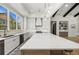 Well-lit kitchen features custom cabinetry, a large island, and modern appliances that offer both style and functionality at 8455 Lindrick Ln, Bradenton, FL 34202