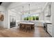 Spacious kitchen boasts a large island, stainless steel appliances, and ample natural light from expansive windows at 8455 Lindrick Ln, Bradenton, FL 34202
