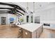 Open kitchen layout with central island, connecting dining and living areas for seamless entertaining and relaxed living at 8455 Lindrick Ln, Bradenton, FL 34202