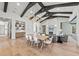 Open dining and living space featuring modern light fixture and seamless flow at 8455 Lindrick Ln, Bradenton, FL 34202