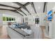 Bright and airy living room featuring a fireplace, contemporary decor, and views of the entry at 8455 Lindrick Ln, Bradenton, FL 34202
