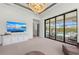 Bright living room with pool views, a large TV, and comfortable seating area at 8455 Lindrick Ln, Bradenton, FL 34202