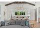 Open concept showcasing dining area, kitchen and modern lighting above the comfortable couch at 8455 Lindrick Ln, Bradenton, FL 34202