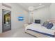Spacious bedroom features an access door, a wall-mounted TV and plush, neutral-toned carpeting at 8455 Lindrick Ln, Bradenton, FL 34202