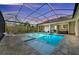 Resort-style covered pool and spa area features an outdoor kitchen and a spacious patio at 8455 Lindrick Ln, Bradenton, FL 34202