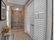 Bathroom showing glass enclosed shower, beautiful tile work, and plantation shutters at 980 S Orange Ave, Sarasota, FL 34236
