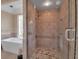 Bathroom showing glass enclosed shower, beautiful tile work, and large soaking tub at 980 S Orange Ave, Sarasota, FL 34236