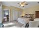 Bright bedroom featuring neutral colored walls, plush carpet and plenty of storage with the white closet doors at 980 S Orange Ave, Sarasota, FL 34236