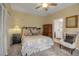 Comfortable bedroom with a warm color palette, plush carpet, and natural light, perfect for relaxation at 980 S Orange Ave, Sarasota, FL 34236