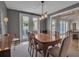 Dining room features hanging light fixture and a connection to the living room at 980 S Orange Ave, Sarasota, FL 34236