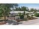 Aerial view of a charming home with lush tropical landscaping, a brick driveway, and a metal roof at 980 S Orange Ave, Sarasota, FL 34236