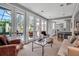 Bright living room featuring access to the kitchen and outdoor patio at 980 S Orange Ave, Sarasota, FL 34236