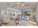 Spacious living room featuring light gray walls, wooden floors and connecting dining room at 980 S Orange Ave, Sarasota, FL 34236