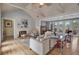Bright and airy living room with wood floors, a fireplace, and comfortable seating at 980 S Orange Ave, Sarasota, FL 34236