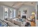Light-filled living room featuring fireplace and access to the outside at 980 S Orange Ave, Sarasota, FL 34236