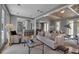 Bright living room boasts an open floor plan, neutral decor, and plenty of natural light at 980 S Orange Ave, Sarasota, FL 34236